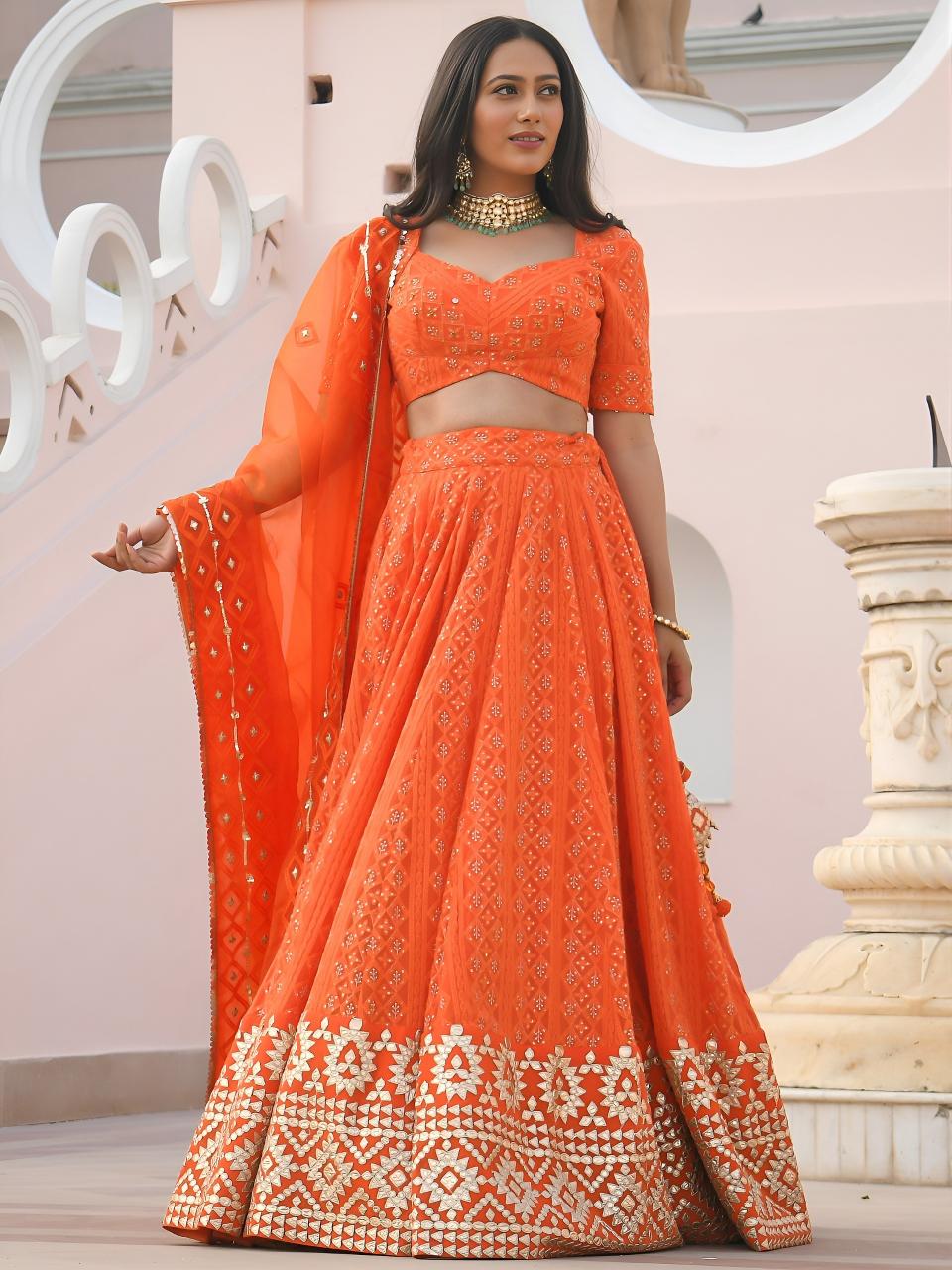 Sabella 7081 Orange catalog lehenga choli wholesale suppliers