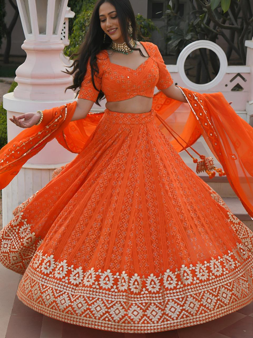 Sabella 7081 Orange catalog lehenga choli wholesale suppliers