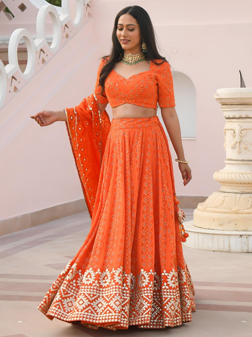 Sabella 7081 Orange catalog lehenga choli wholesale suppliers